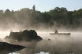 Canoeing on a Misty Lake
