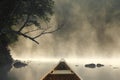 Canoeing on a Misty Lake Royalty Free Stock Photo