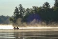 Canoeing on a misty morning Royalty Free Stock Photo