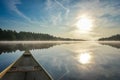 Canoeing on a misty summer morning on Corry Lake. Royalty Free Stock Photo