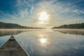 Canoeing on a misty summer morning on Corry Lake. Royalty Free Stock Photo