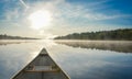 Canoeing on a misty summer morning on Corry Lake. Royalty Free Stock Photo