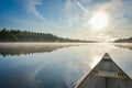 Canoeing on a misty summer morning on Corry Lake. Royalty Free Stock Photo