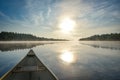 Canoeing on a misty summer morning on Corry Lake. Royalty Free Stock Photo