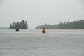 Canoeing into the rain Royalty Free Stock Photo