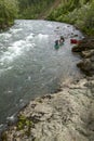 Canoeing river rapids in wild, remote Alaska