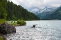 Canoeist in the lake of the Alps Royalty Free Stock Photo