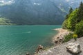 Canoeist on Lake Kloentalersee in the Glarner Alps in Switzerland Royalty Free Stock Photo