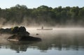 Canoeist on a Misty Lake, Haliburton Royalty Free Stock Photo