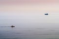 Canoeist and Power Boat