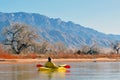 Canoeist on scenic lake