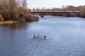 Canoeists paddling through the Tormes River in Salamanca, Spain Royalty Free Stock Photo