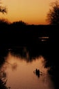 Canoeists at sunset Royalty Free Stock Photo