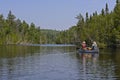 Canoers Heading into a North Woods lake