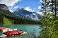 Canoes on a dock at the Beautiful Emerald lake Royalty Free Stock Photo