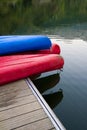 Canoes on a dock next to a lake Royalty Free Stock Photo