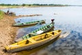 Canoes docked at the river`s edge