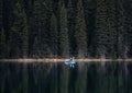 Canoes floating peacefully on the waters of Lake Louise, Banff National Park, Alberta, Canada. Royalty Free Stock Photo