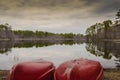 Canoes by lake side and reflection