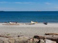 Canoes lined up at the sandy Willows beach