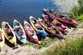 Canoes on a river-bank.