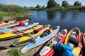 Canoes on a river-bank.