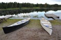 Canoes by the side of a lake