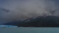 Canoes with tourists sail along the turquoise glacial lake to the glacier. Royalty Free Stock Photo