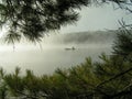 Canoing on misty lake Royalty Free Stock Photo