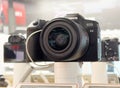 Canon eos r8 mirrorless camera on display with lens and accessories Royalty Free Stock Photo