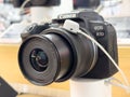 Canon eos r10 mirrorless camera with zoom lens on store display Royalty Free Stock Photo