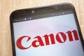 Canon logo displayed on a modern smartphone