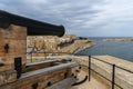 Canon pointing over Valetta Harbor in Malta