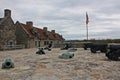 Canons along outer wall and on the stone pavers in front of the barracks in Fort Ticonderoga, Ticonderoga, New Yor