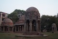 Canopies in pink stones and bricks, pillars standing on low pedestal in Houz Khas Complex, Delhi, India.Imsge taken on 16.2.2016.