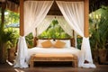 a canopy bed in a luxurious tropical resort