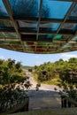 Canopy colored but dirty outside, with vegetation surrounding Royalty Free Stock Photo