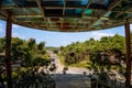 Canopy colored but dirty, outside, , with stairs, and vegetation surrounding Royalty Free Stock Photo