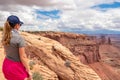 Canoynlands - Rear view of woman in front of Mesa Arch near Moab, Canyonlands National Park, San Juan County, Southern Utah, USA Royalty Free Stock Photo