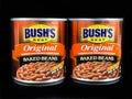Cans of Bush`s Original Baked Beans on a Black Backdrop