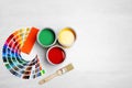 Cans with paint, brush and color palette Royalty Free Stock Photo