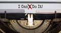 Cant crossed out to read I can do it concept for self belief, positive attitude and motivation written on an old typewriter Royalty Free Stock Photo