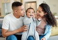 They cant resist this little one. a young family bonding with their baby boy at home. Royalty Free Stock Photo