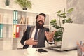 Cant resist music. Businessman enjoy music in office. Bearded man listen to music and sing along to song. Insurance