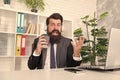 Cant think about work. Manager use coffee cup as microphone at work. Bearded man sing karaoke during workday. Rest break Royalty Free Stock Photo