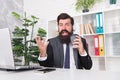 Cant think about work. Manager use coffee cup as microphone at work. Bearded man sing karaoke during workday. Rest break Royalty Free Stock Photo