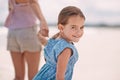 Cant wait to have fun with mum. a little girl and her mother hand in hand at the beach. Royalty Free Stock Photo