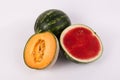 Cantaloup sweet organic watermelon whole sliced on solid white background