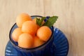 Cantaloupe Balls In Blue Teacup Close Up