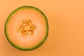Cantaloupe Orange Melon Sliced in Half on Pastel Background Royalty Free Stock Photo